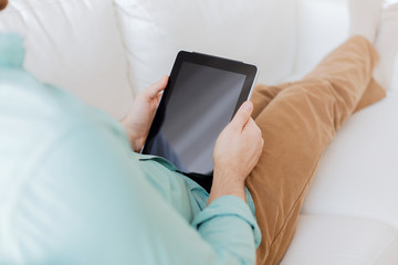 close up of man with tablet pc computer at home