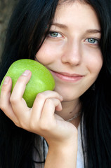 Beautiful girl with green apple