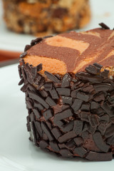 Coco cream desert with dark hocolate closeup