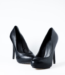 Woman black shoes on white