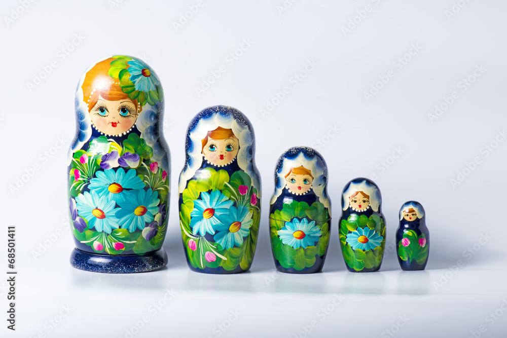 Wall mural Green matryoshka isolated on white