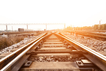 Cargo train platform at sunset with container