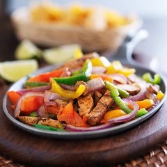 mexican chicken fajitas in iron skillet with peppers
