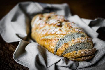 Whole grain bread on rustic background