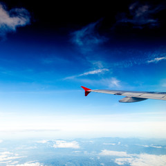 Fototapeta premium Classic image through aircraft window onto jet engine