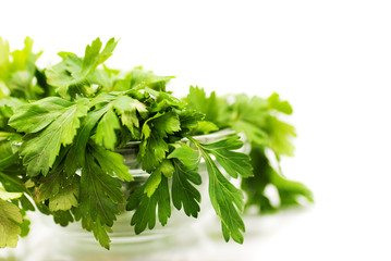 Parsley in bowl over white