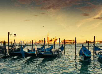 Naklejka premium Gondolas moored by Saint Mark square with San Giorgio di Maggior