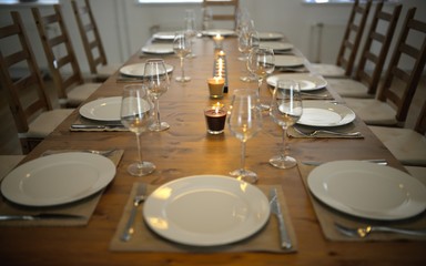Covered dining table with wine glasses