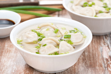 Chinese dumplings in chicken broth