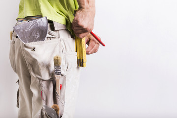 Man with masonry and painting tools