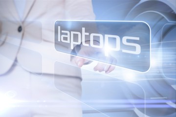 Businesswoman pointing to word laptops