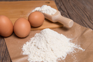 Flour spoon and eggs