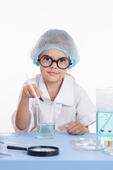 Chemist pours reagent liquid in the flask