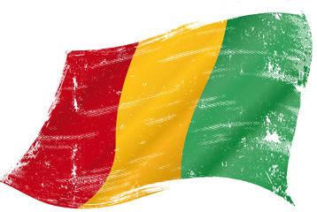 waving Guinean grunge flag