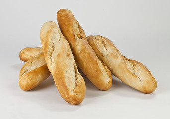 six baguettes on a white background
