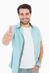 Fototapeta premium Happy casual man showing thumbs up