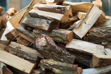 firewood background - chopped firewood on a stack