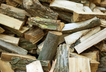firewood background - chopped firewood on a stack