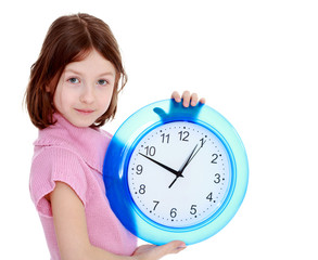 Cute Girl Shows the clock
