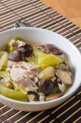 Pickled lettuce soup with shiitake mushroom and pork