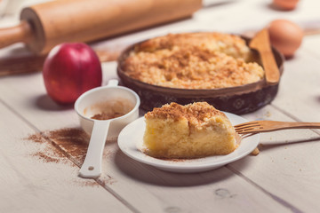 Close up of pie apple with cinnamon on wooden desk