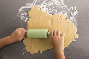 Little girl making cookie dough - obrazy, fototapety, plakaty