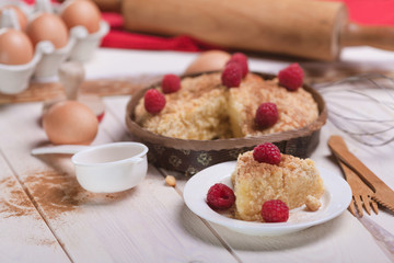 Close up of delicious raspberries pie on wooden planks