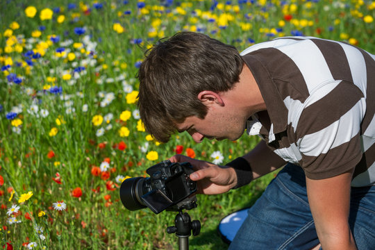 handsome photographer/videographer in botanic gardens