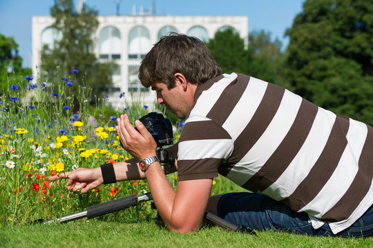 handsome photographer/videographer in botanic gardens