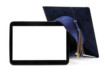 blank digital tablet and education student cap - obrazy, fototapety, plakaty