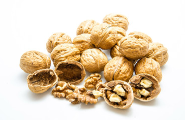 walnut and a cracked walnut on the white background