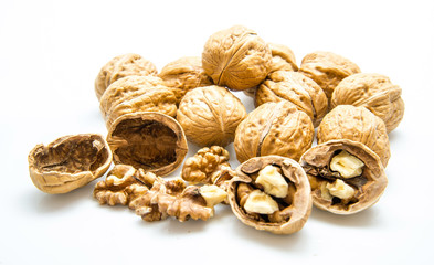 walnut and a cracked walnut on the white background