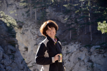 Happy hiker with cup of tea