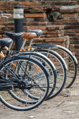 Fototapeta na wymiar Wheel of bicycle for rent in thailand background