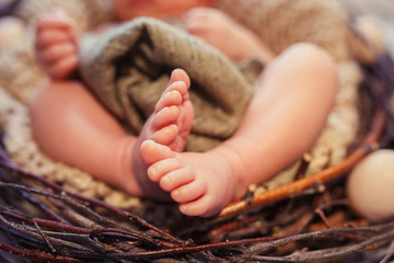 Baby feet in a basket