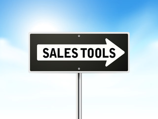 sales tools on black road sign