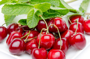 Fresh red cherries with mint