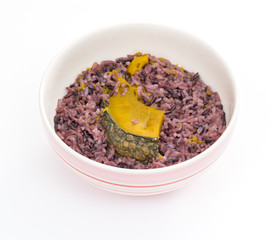Bowl of cooked brown rice and pumpkin