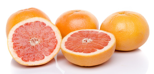 Obraz na płótnie Canvas Grapefruits and half grapefruits
