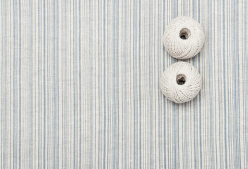 Thread Balls On Natural Linen Striped Textile