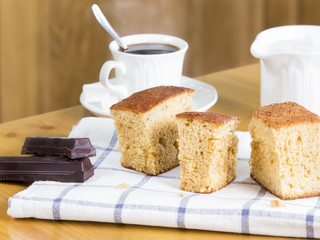Piece of sponge cake, coffee and chocolate
