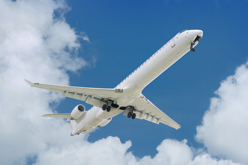 big jet plane landing  blue cloudy sky background