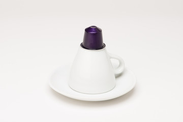 Coffee cup with capsule