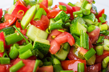 vegetable salad with fresh tomatoes cucumbers and green onions