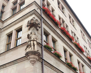 Beautiful old building with stone knight