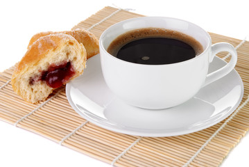 Cup of black coffee and a doughnut with strawberry jam