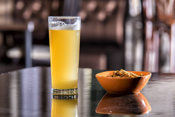 glass of beer and a snack