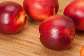 Fresh Nectarine Fruits On Wooden Board