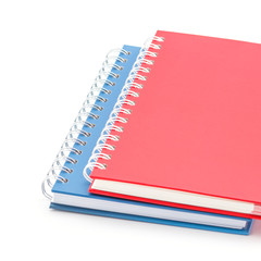 Stack of red and blue color notebooks.