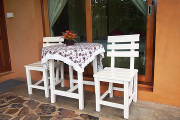white wooden table and chair in front of room